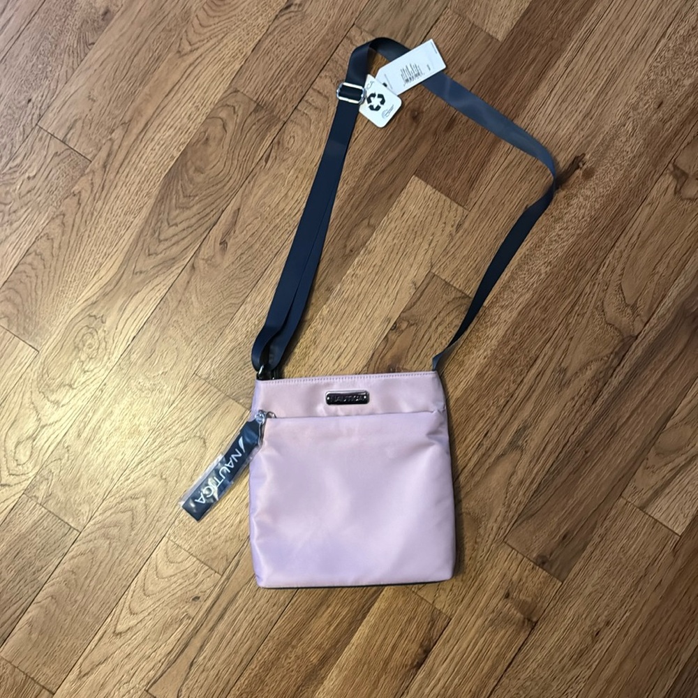 NWT.  Cute Purple purse. Adjustable strap
